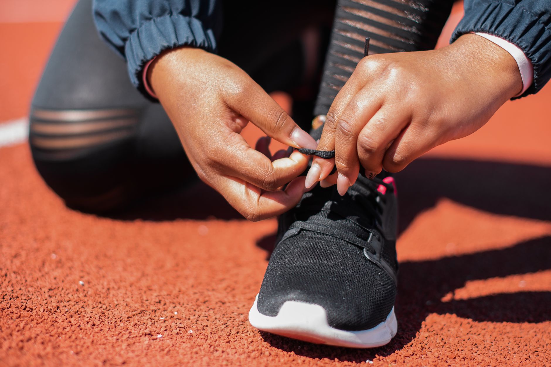 close view of running shoes on a track surface
