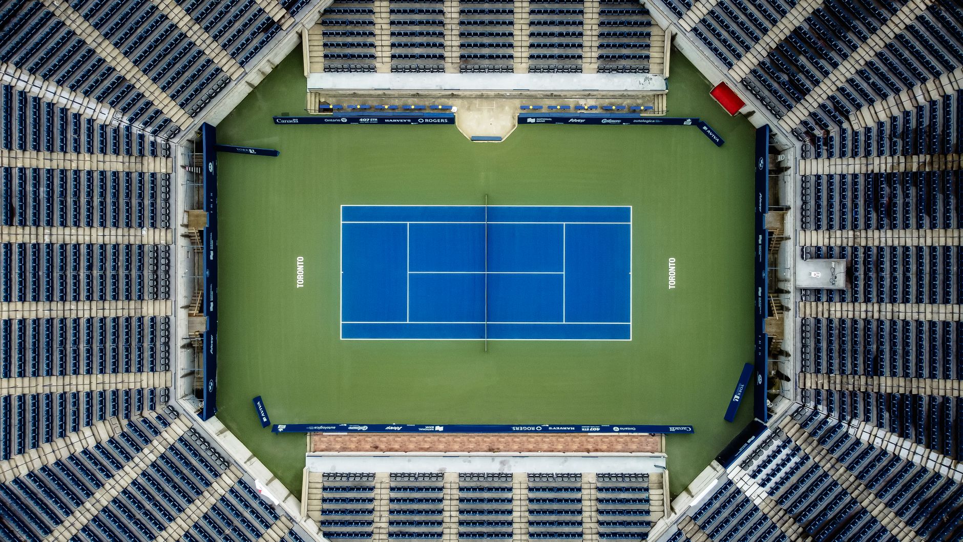 empty tennis stadium seating at dusk