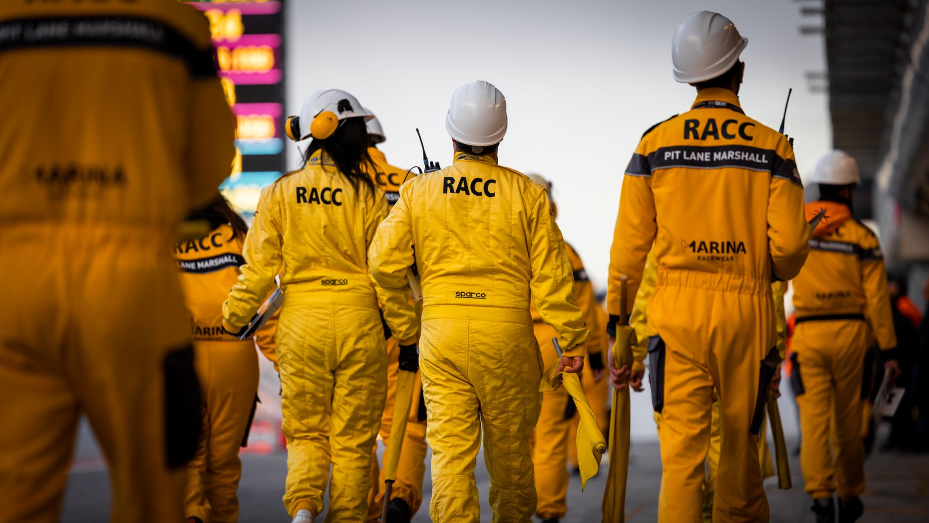 pit crew preparing tyres in the pit lane